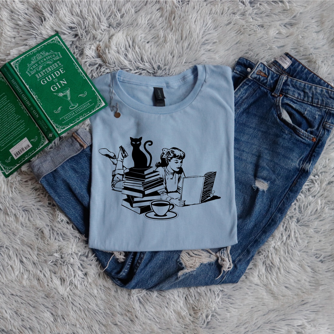 Cat, girl and books