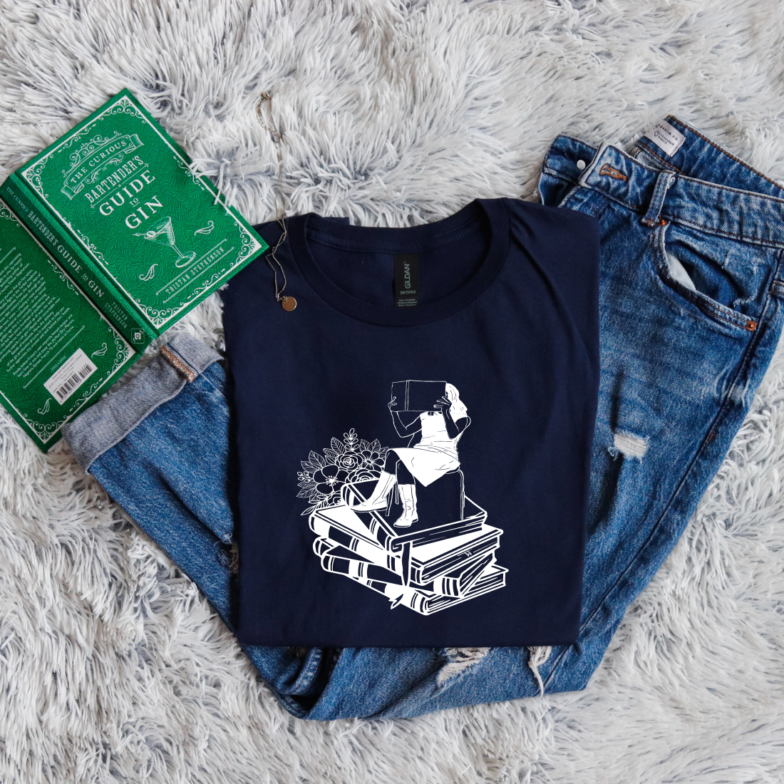 Girl Sitting On Books Reading Flowers