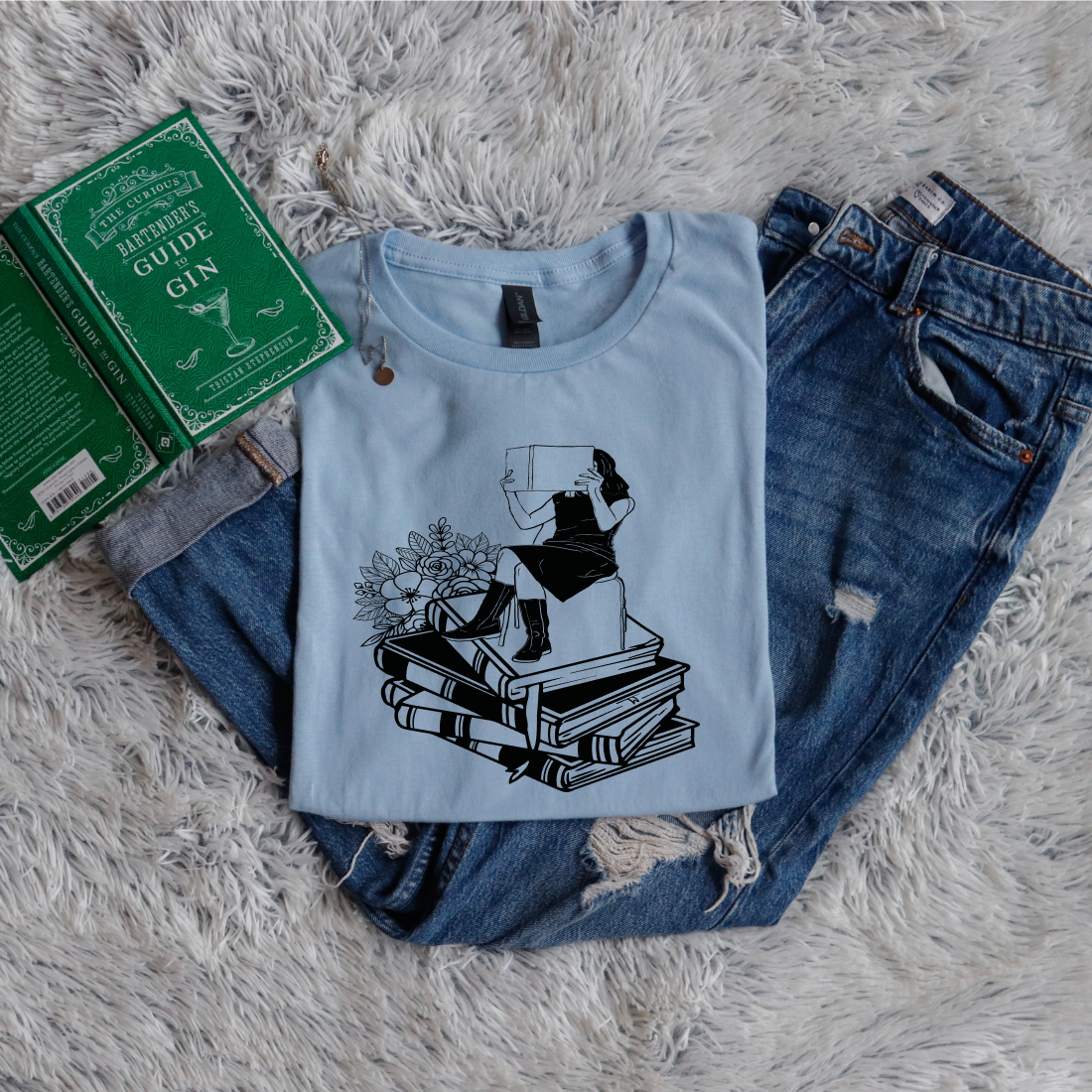 Girl Sitting On Books Reading Flowers