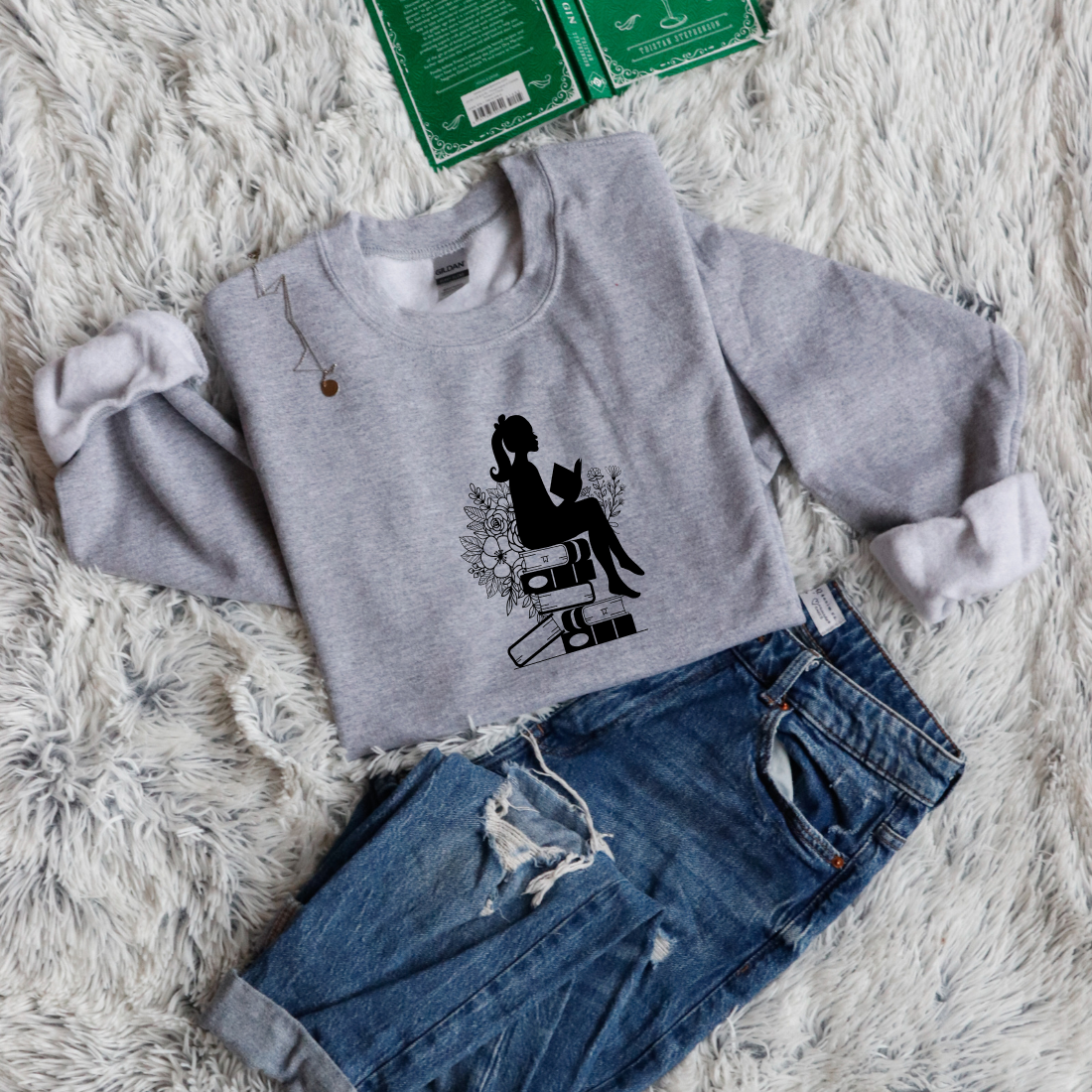 Girl shadow sitting on books reading