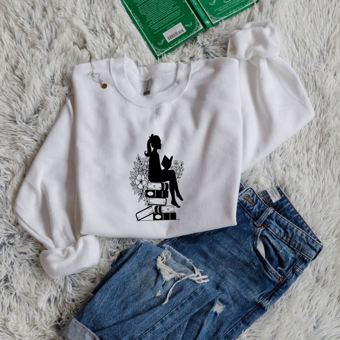 Girl shadow sitting on books reading