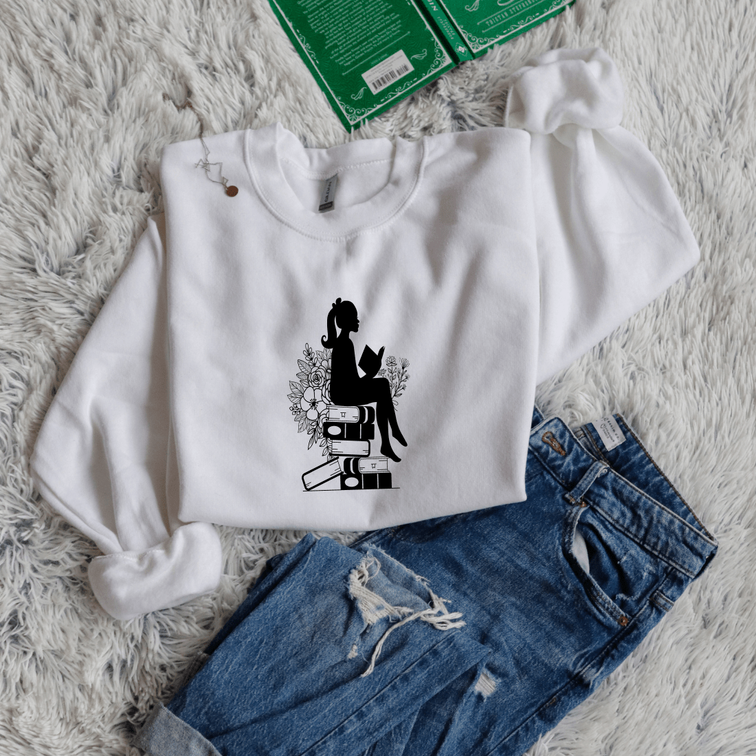 Girl shadow sitting on books reading - Bookish Wardrobe