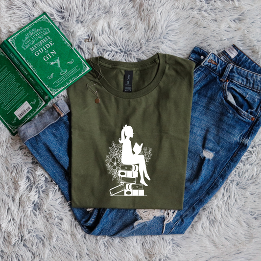 Girl shadow sitting on books reading