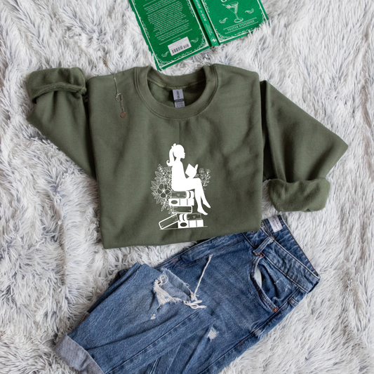 Girl shadow sitting on books reading